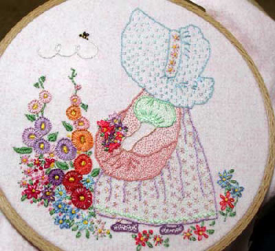 Sunbonnet Sue in an Embroidered Garden, with a bee