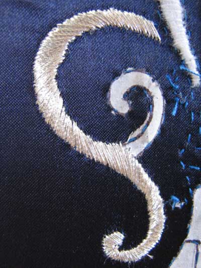 Satin Stitching with Metal Threads: Fleur-de-lis in silver thread on blue silk ground