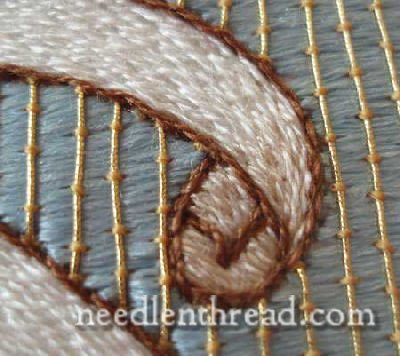 Agnus Dei banner worked in silk in stem stitch