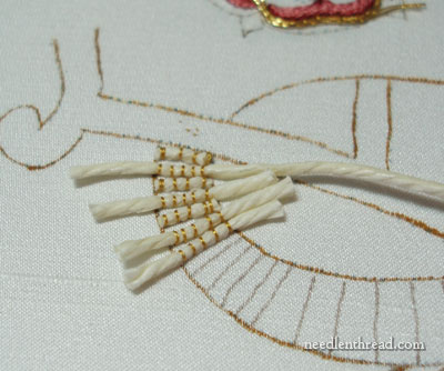 Weaving with gold thread and beads