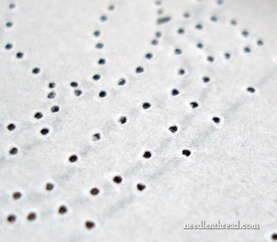 Sanding the back of an embroidery pattern
