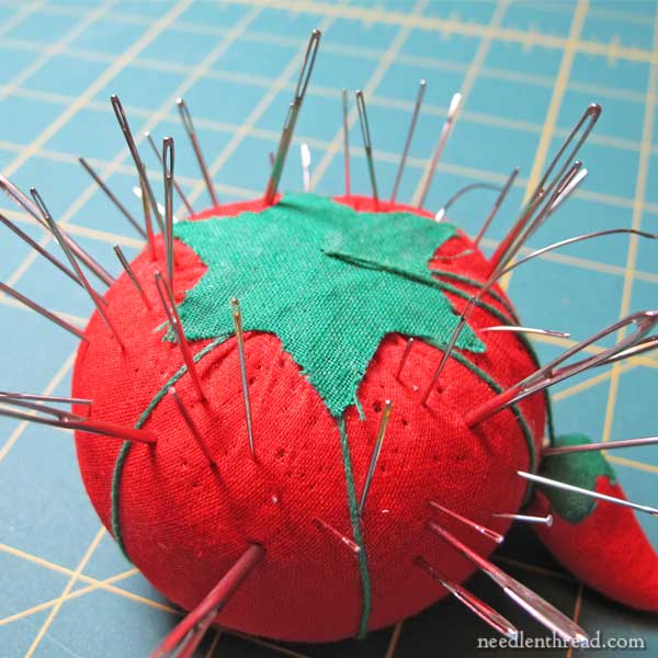 Pincushion with embroidery needles