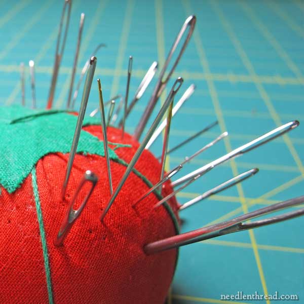 Pincushion with embroidery needles