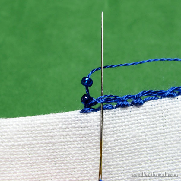 Scalloped & beaded buttonhole stitch edging using seed beads