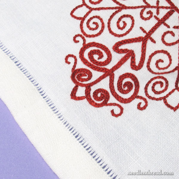 Hem stitching on an embroidered redwork table runner