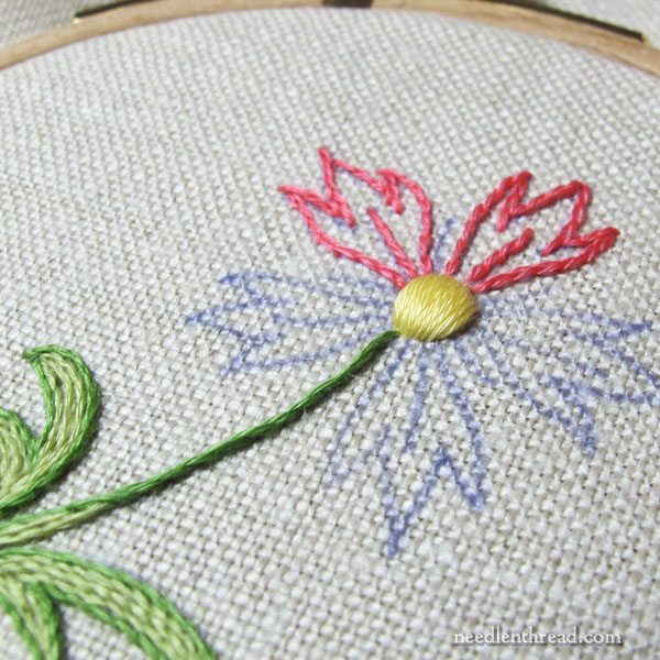 Embroidery with cotton floche on linen fabric
