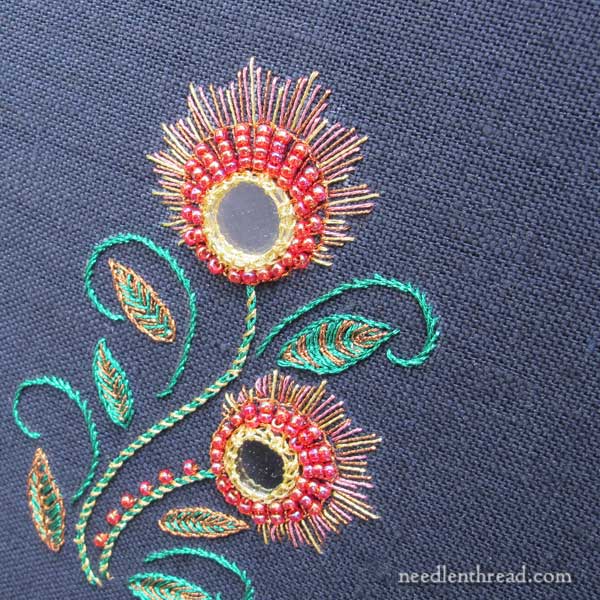 shisha embroidery with metallic threads on dark fabric