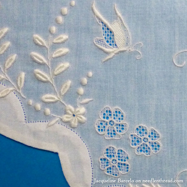 Fine whitework embroidery, monogram, and needle lace on muslin