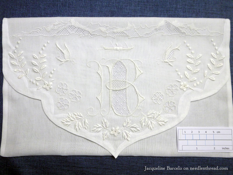 Fine whitework embroidery, monogram, and needle lace on muslin