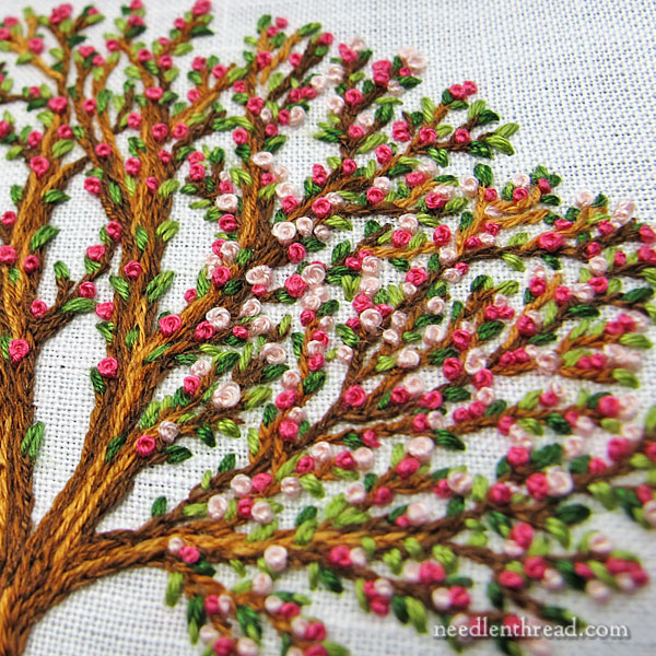 Hand Embroidered Tree, Blooming, worked with split stitch, seed stitch, and French knots