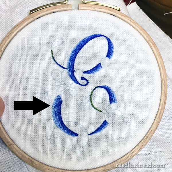 E Monogram embroidered in shaded stem stitch filling