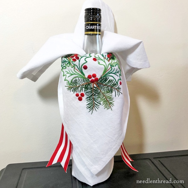 Wrapping a bottle with embroidered flour sack towel