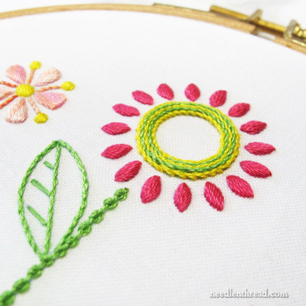Embroidered Line of Stylized Flowers for household linens
