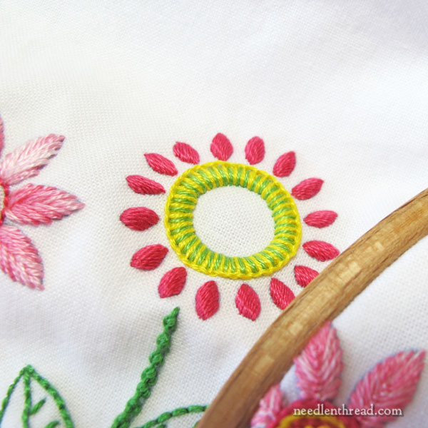 Embroidered Line of Stylized Flowers for household linens
