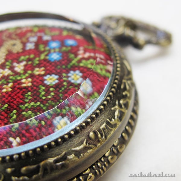 Silk Gauze embroidery finished in a pocket watch setting