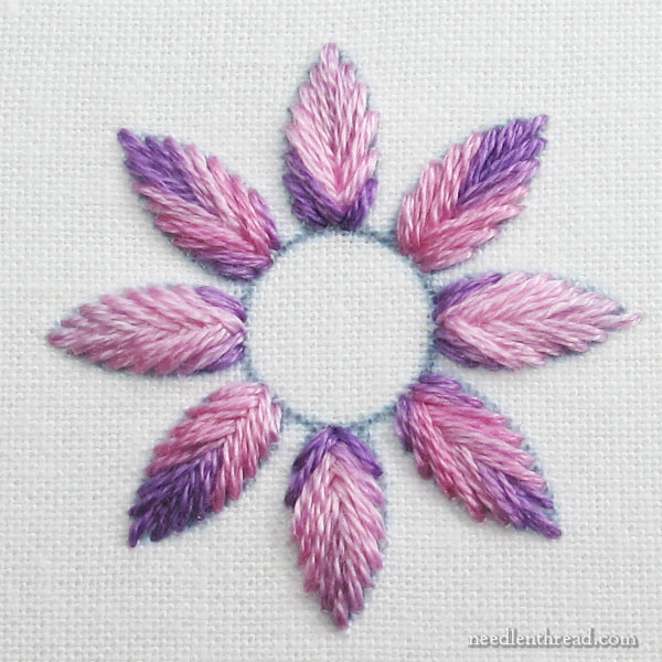 Flower stitched with DMC Variations 4620, straight off the skein