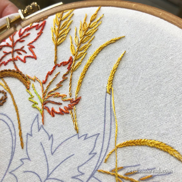hand embroidery autumn design with pumpkin, leaves, wheat