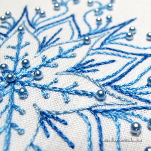 Snowflakes in hand embroidery