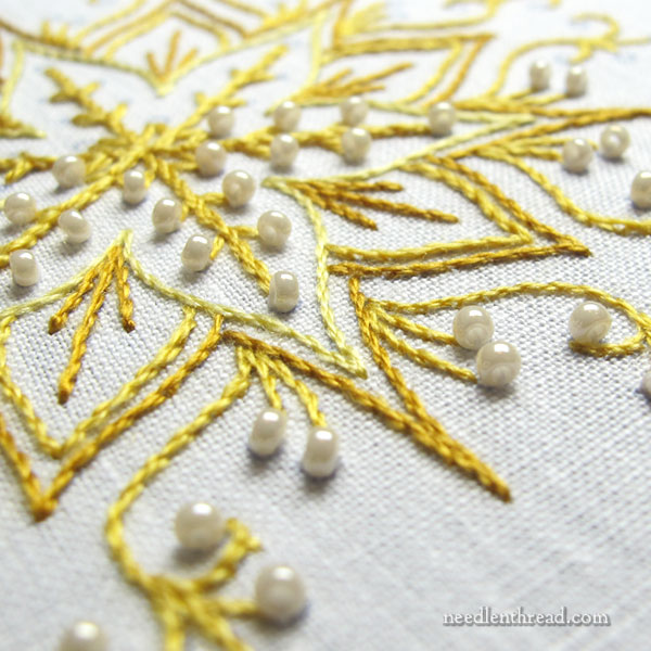 Testing embroidery ideas on snowflakes