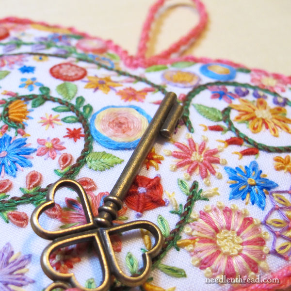Hand embroidered floral heart with key