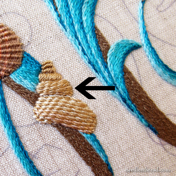 Embroidering a striped seashell