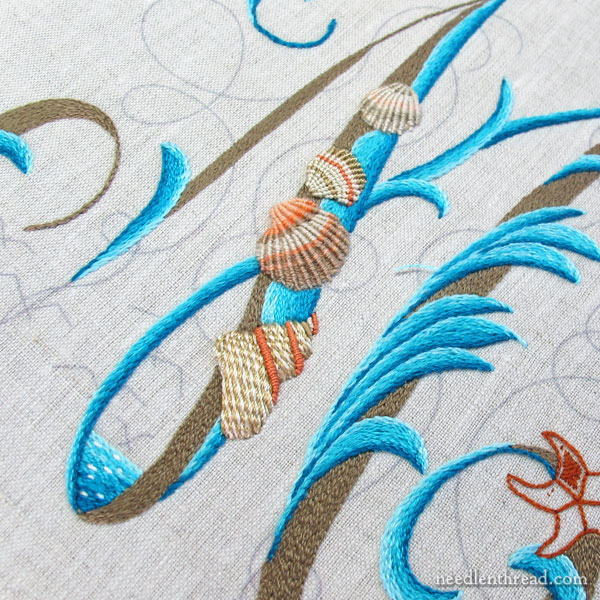 Embroidered monogram M with seashells