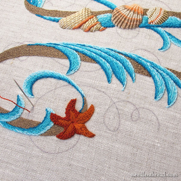 Embroidered monogram M with seashells