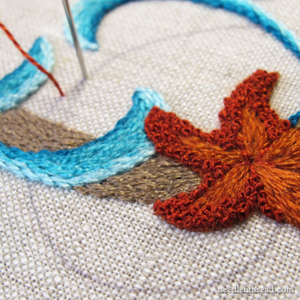 Embroidered monogram M with seashells