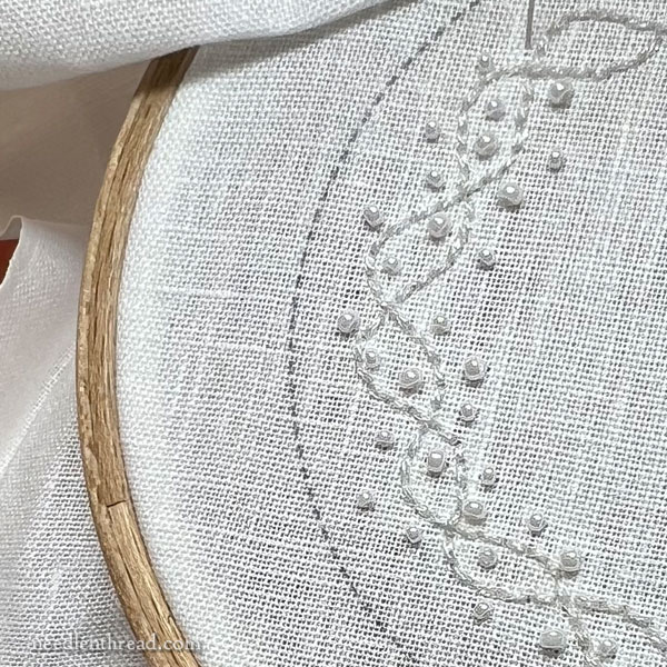 White embroidery with white beads and sparkle
